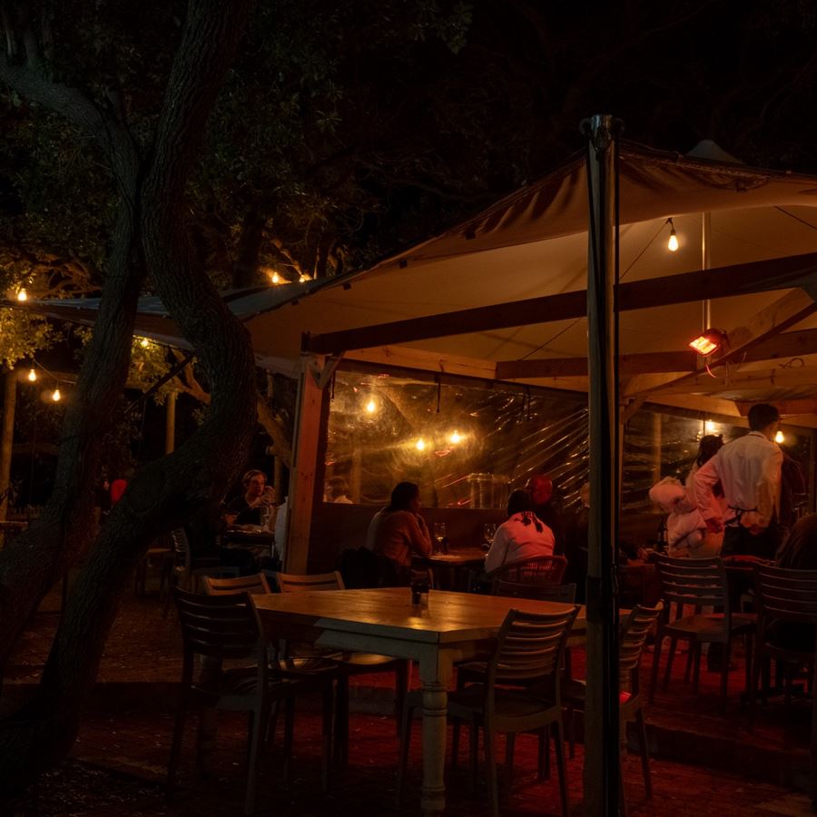 Guests dining on the terrace in the evening